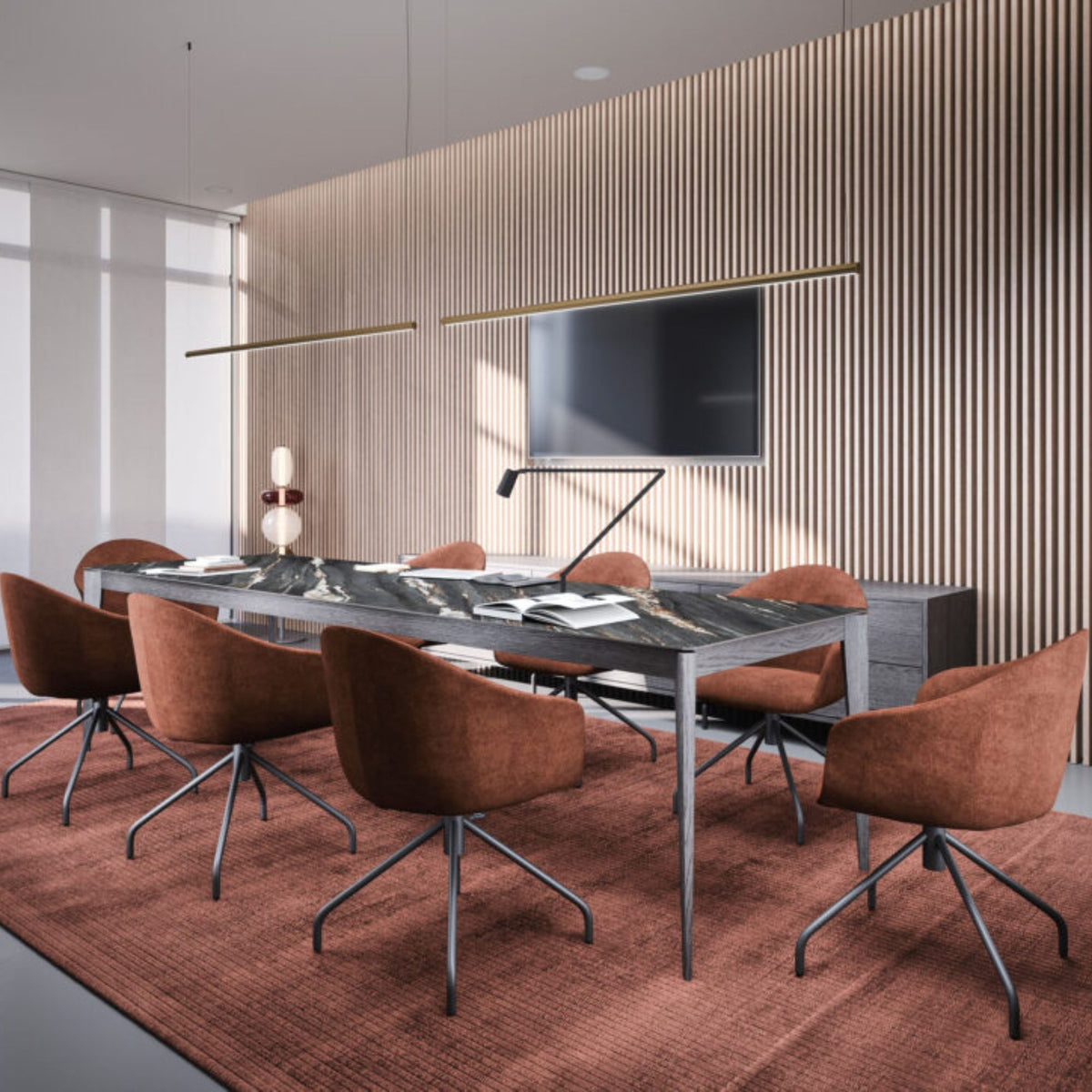 Luxury rectangular black marble dining table with a grey metal frame, paired with upholstered terracotta dining chairs in a contemporary dining room featuring wood slat wall panels and modern lighting.