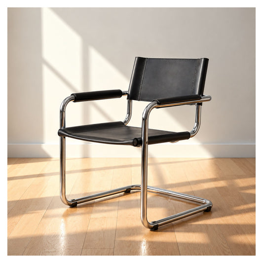 Black leather Mart Stam-inspired cantilever armchair with tubular steel frame in a sunlit room