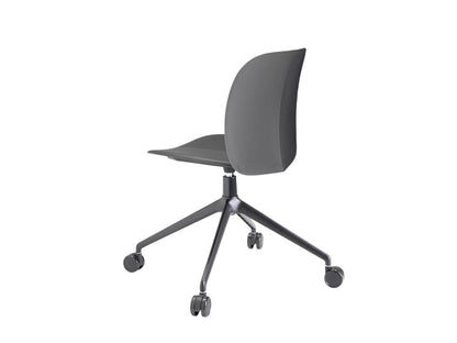 Rear angled view of the S•CAB Mentha office chair with grey upholstered seat, black swivel base, and smooth-rolling castors.