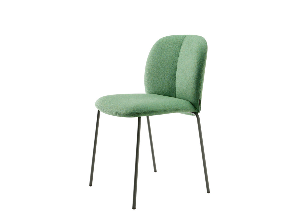 Front angled view of the Mentha Pop 2720 upholstered dining chair with green fabric upholstery and slim dark metal legs.