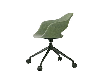 Rear angled view of the Mentha Pop office chair with green upholstered shell seat, black swivel base, and smooth-rolling castors.