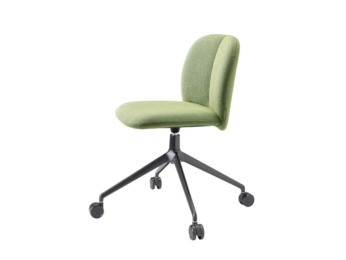 Side angled view of the Mentha Pop green upholstered office chair with a curved backrest, black swivel base, and castors.
