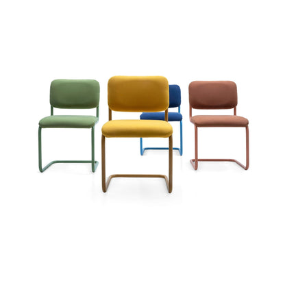 Modern upholstered cantilever dining chairs with padded fabric seats and backrests in green, mustard yellow, blue and terracotta finishes, featuring minimalist sled base metal frames.