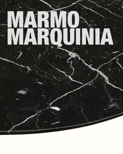 Black marble surface with 'Marmo Marquinia' text