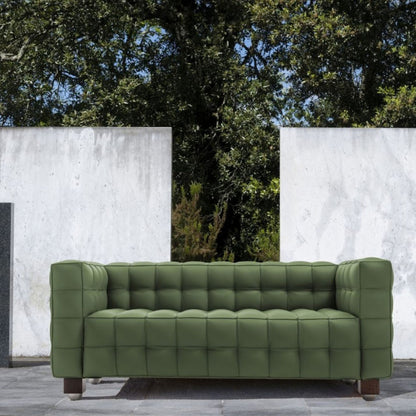 Olive green tufted leather cube sofa with deep square quilting and a minimalist geometric silhouette, inspired by iconic Italian modernist design, suitable for contemporary indoor and outdoor living spaces.