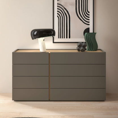 Modern dresser with decorative items against a neutral wall