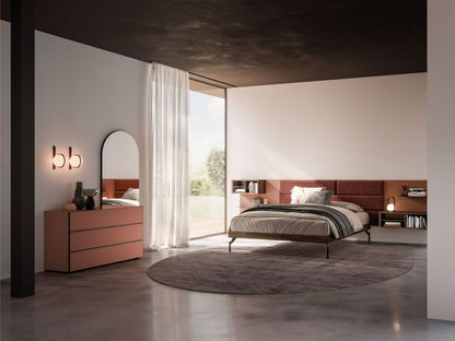 Modern bedroom with a bed, dresser, and large window.