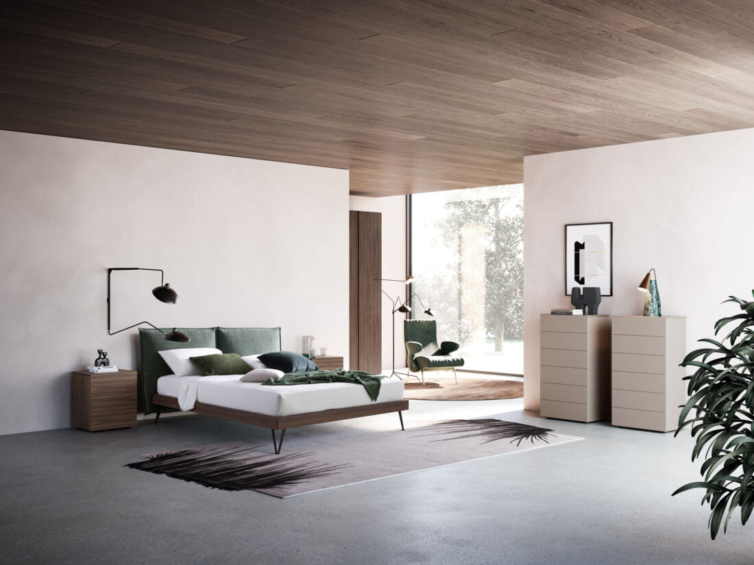 Modern bedroom with a bed, nightstands, and a dresser.