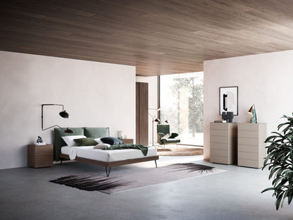 Modern bedroom with a bed, nightstands, and a dresser.