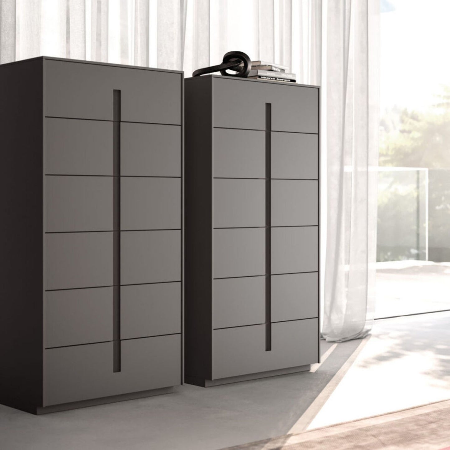 Two modern gray dressers with multiple drawers in a bright room.