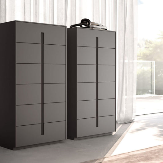 Two modern gray dressers with multiple drawers in a bright room.