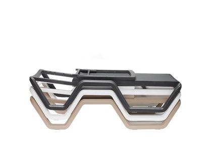 Stacked outdoor sun loungers in black, taupe, and white finishes demonstrating the space-saving stackable design.
