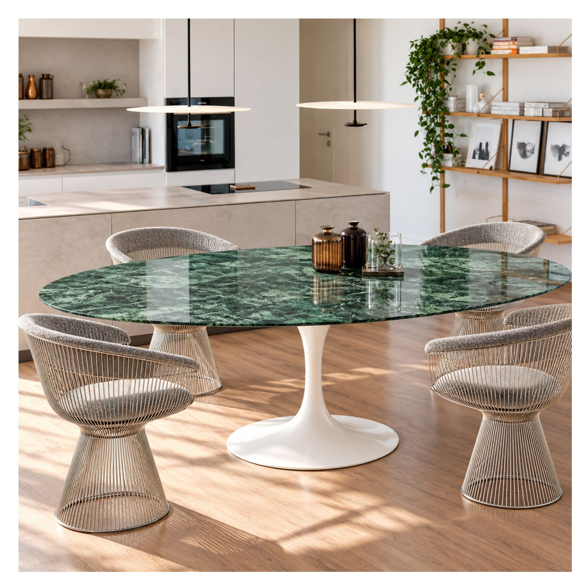 Oval Tulip dining table with a glossy green marble top and white pedestal base, surrounded by woven wire chairs in a modern kitchen.