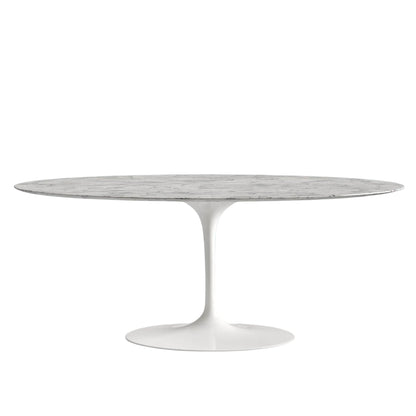 Round marble table with white base on a white background