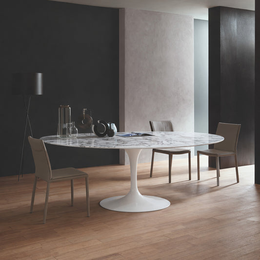 Oval tulip table Saarinen style with white marble top in modern dining room