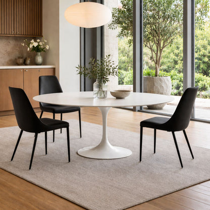 Oval tulip table Saarinen style with white top and black chairs in modern dining room