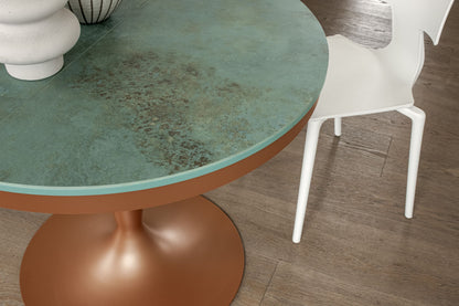 Close-up of green ceramic pedestal table top with textured finish