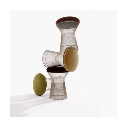 Platner upholstered wire-frame stool with a polished stainless steel base and brown cushioned seat.