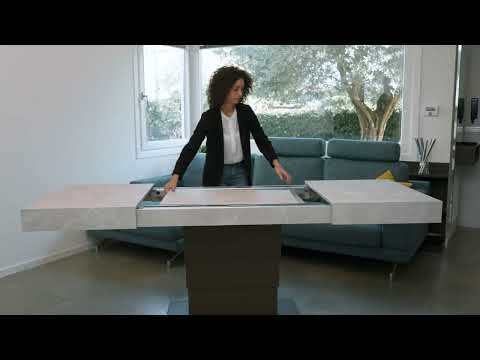 Ares Fold transforming coffee table by Altacom lifting and extending from compact position into full dining table with hidden extension leaves