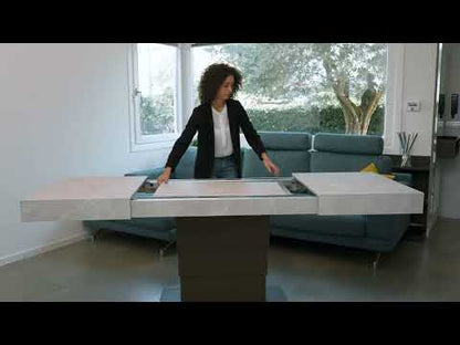 Ares Fold transforming coffee table by Altacom lifting and extending from compact position into full dining table with hidden extension leaves