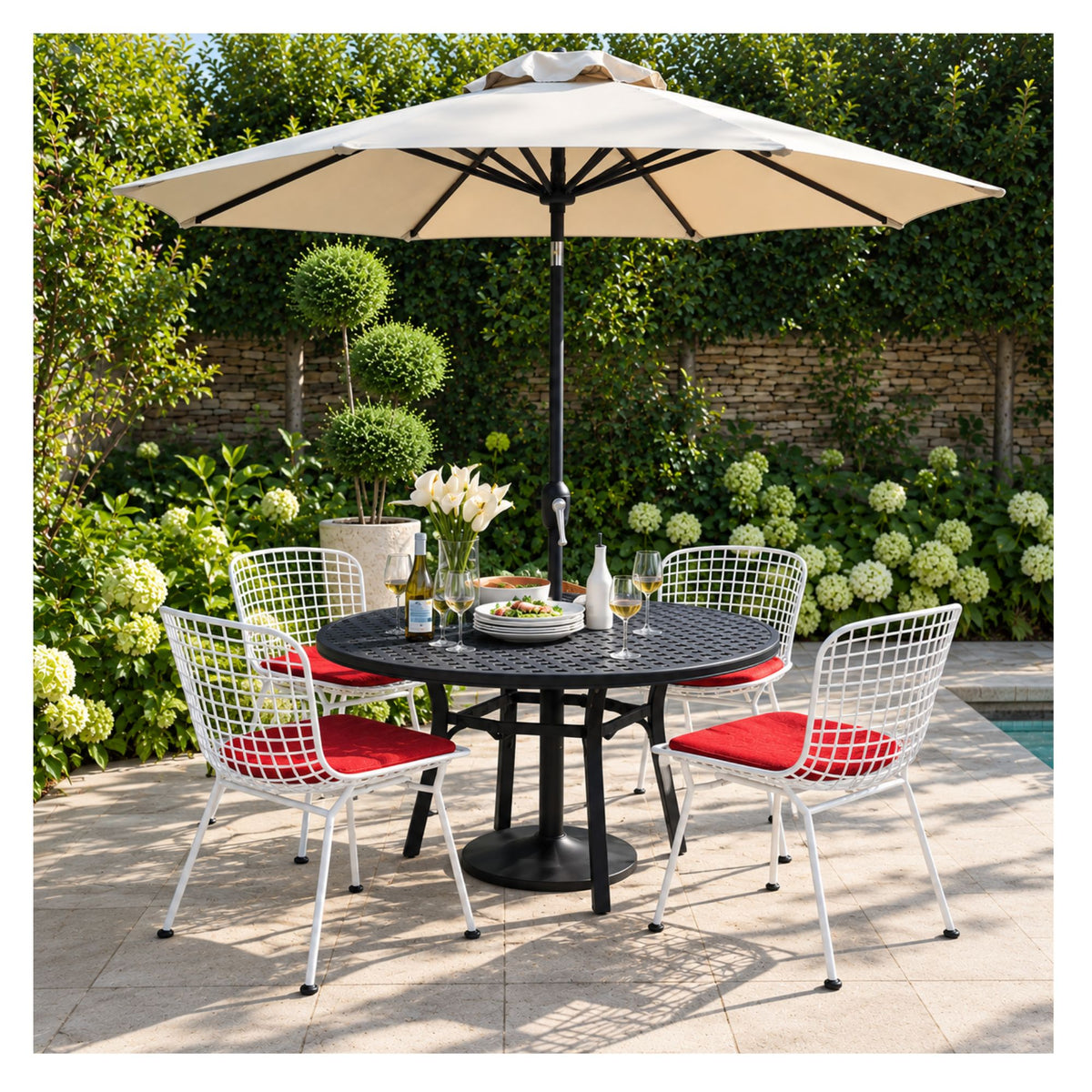 Red wire chair with seat cushion on a garden patio beneath a parasol