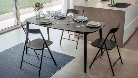 Ribot Wood extendable dining table by Altacom with dark oak wood top, stained ash legs and internal folding extension in a modern kitchen