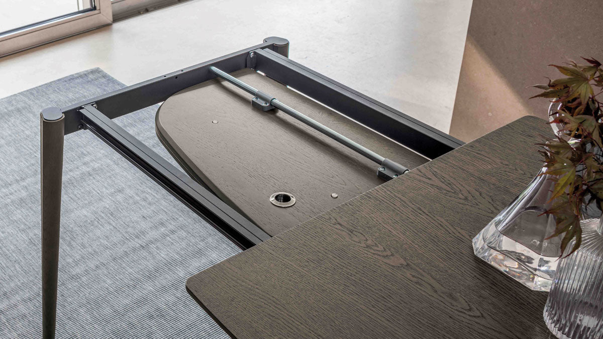 Internal book extension stored inside the Ribot Wood extendable dining table by Altacom