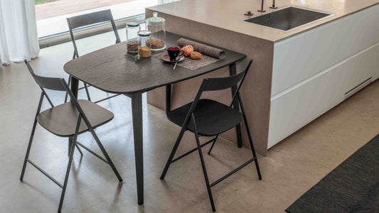 Ribot Wood compact extendable dining table by Altacom with dark oak finish and stained ash legs for modern kitchens