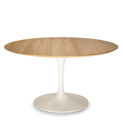 Round oak tulip dining table with natural wood top and white pedestal base isolated on a white background
