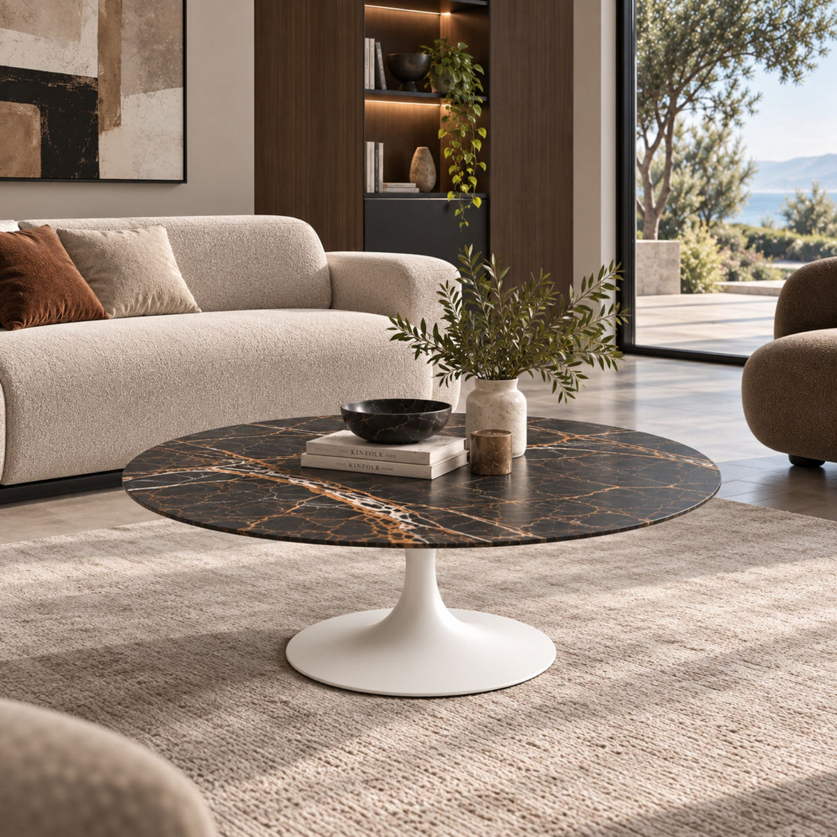 Round & oval Tulip coffee table with a black Marquina marble-effect ceramic top and white pedestal base styled in a contemporary living room