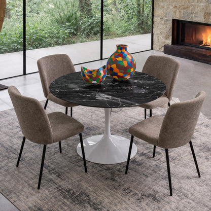 Round tulip table Saarinen style with black marble top and white pedestal base in modern dining room