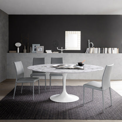 Round tulip table Saarinen style with white marble top in modern dining room