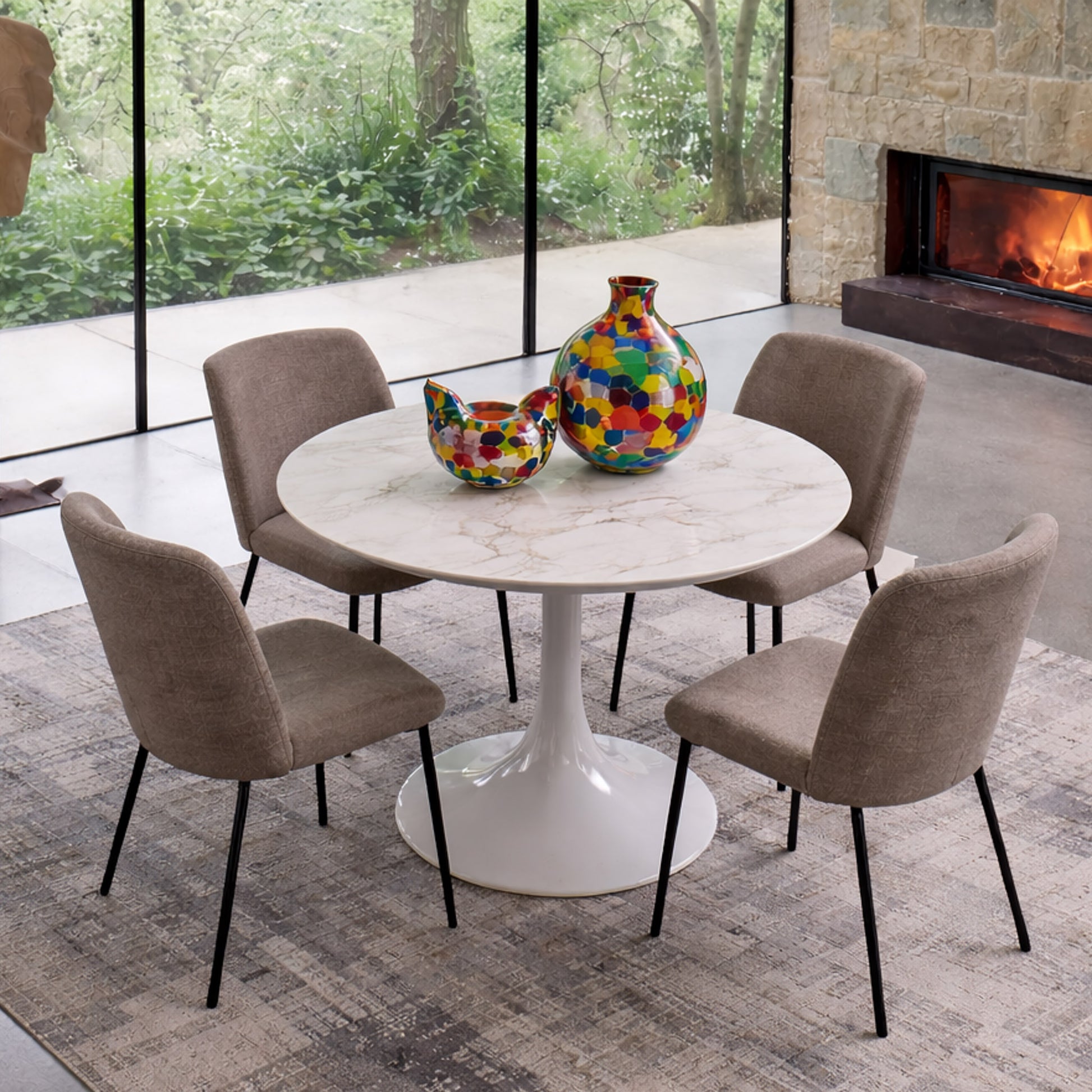 Round tulip table Saarinen style with white marble top and brown upholstered chairs in modern dining room with natural light