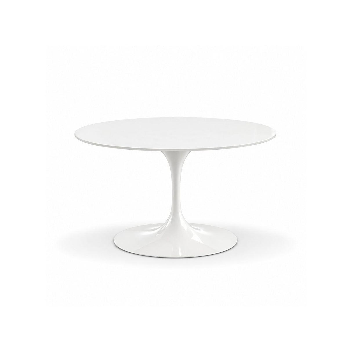 Round white tulip dining table with a white laminate top and sculptural white pedestal base, inspired by mid-century modern Italian design.