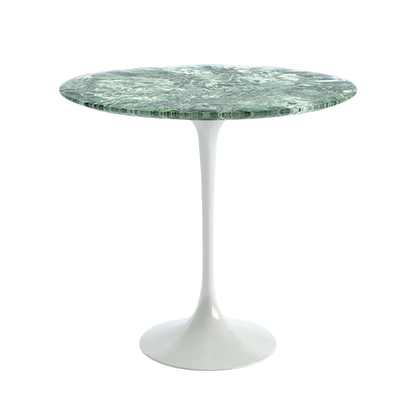 Round marble tulip dining table with a white base on a white background