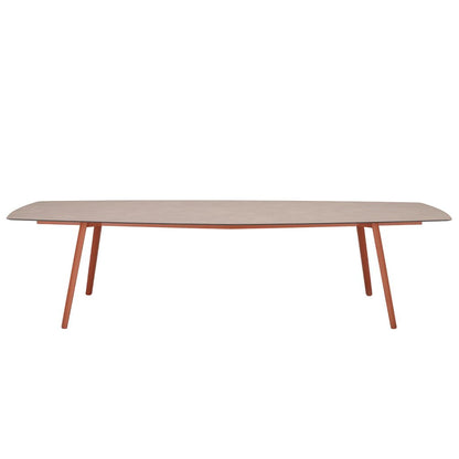 Front view of the S•CAB Squid Hexagonal Dining Table with a wood-effect hexagonal tabletop and terracotta angled metal legs.