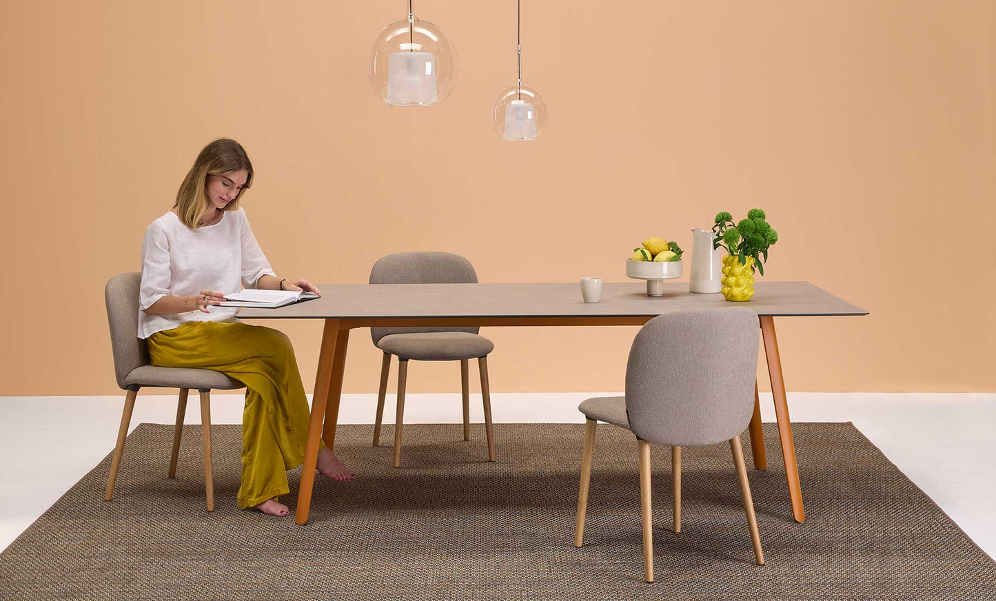 S•CAB Squid Hexagonal Dining Table with a wood-effect hexagonal tabletop and terracotta metal legs in a contemporary dining room setting.