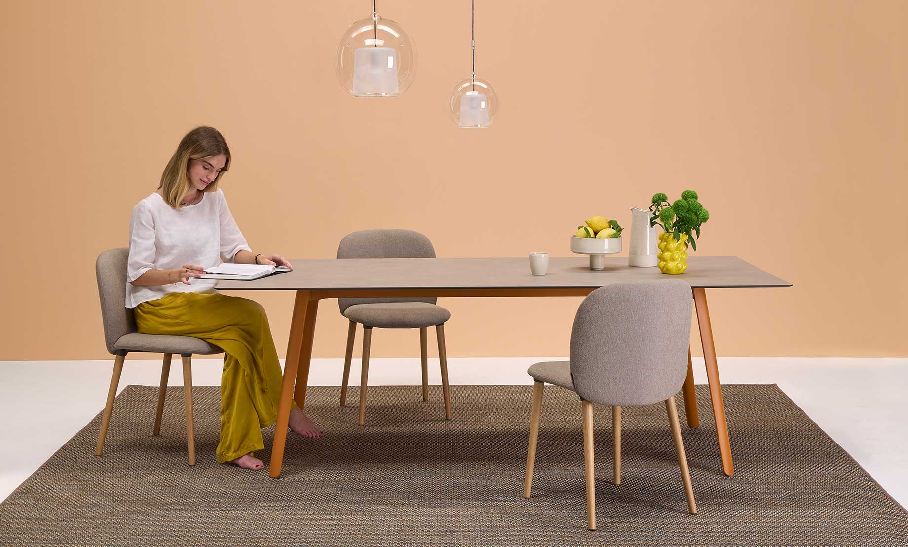 S•CAB Squid Hexagonal Dining Table with a wood-effect hexagonal tabletop and terracotta metal legs in a contemporary dining room setting.