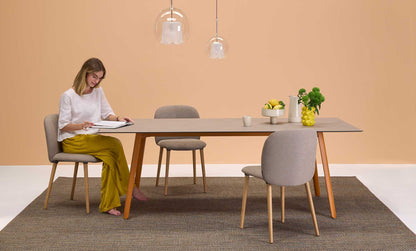 S•CAB Squid Hexagonal Dining Table with a wood-effect hexagonal tabletop and terracotta metal legs in a contemporary dining room setting.
