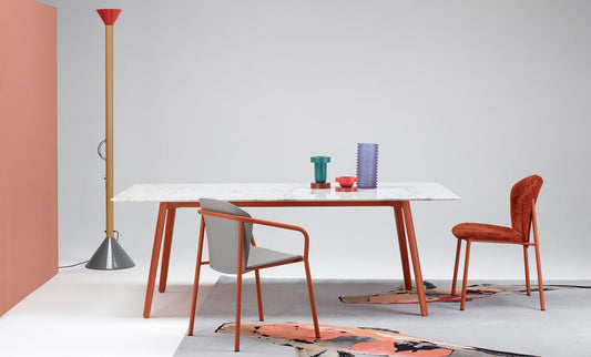S•CAB Squid M Marble Dining Table with a white marble-effect tabletop and terracotta metal legs in a contemporary dining room setting.