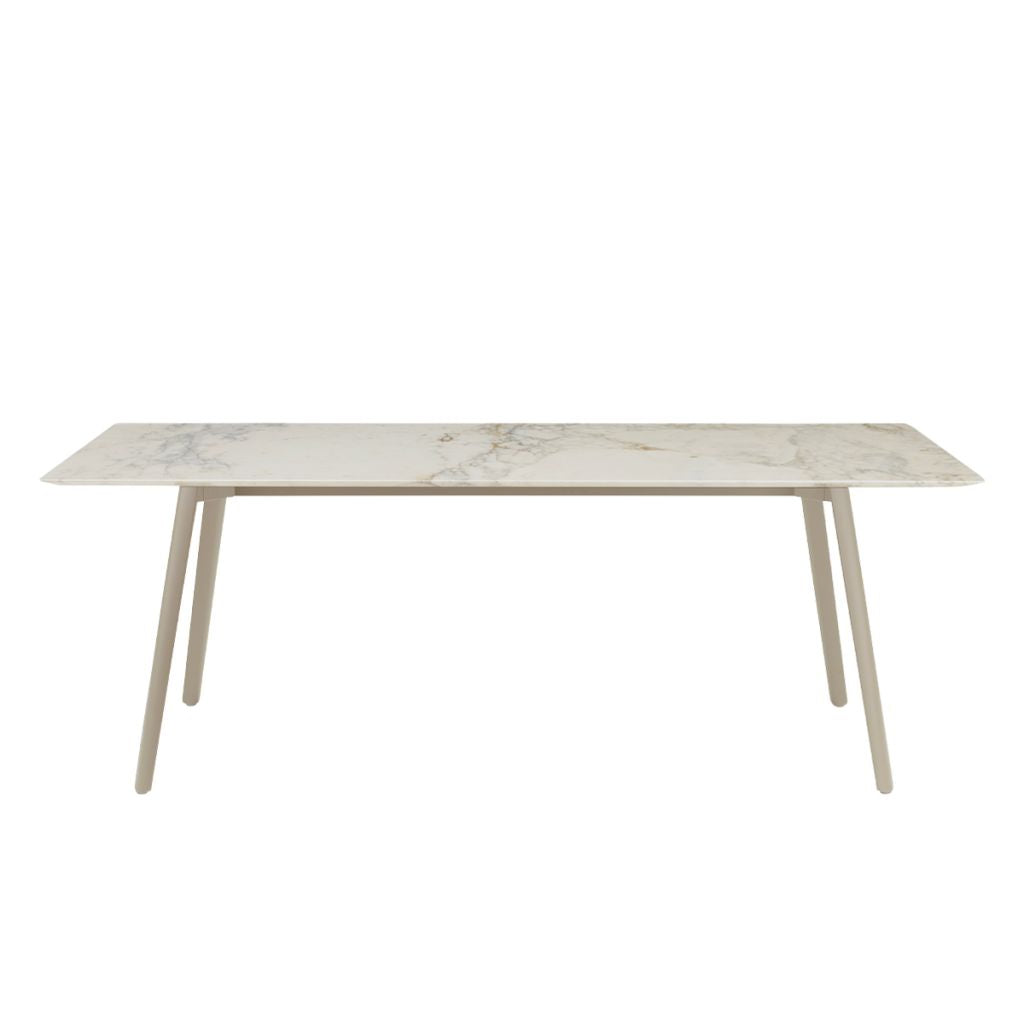 Front view of the S•CAB Squid M Marble Dining Table with a white marble-effect tabletop and matching light-coloured angled metal legs.