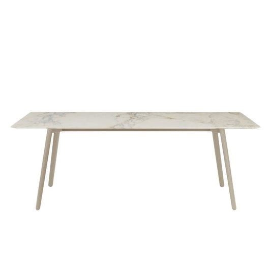 Front view of the S•CAB Squid M Marble Dining Table with a white marble-effect tabletop and matching light-coloured angled metal legs.