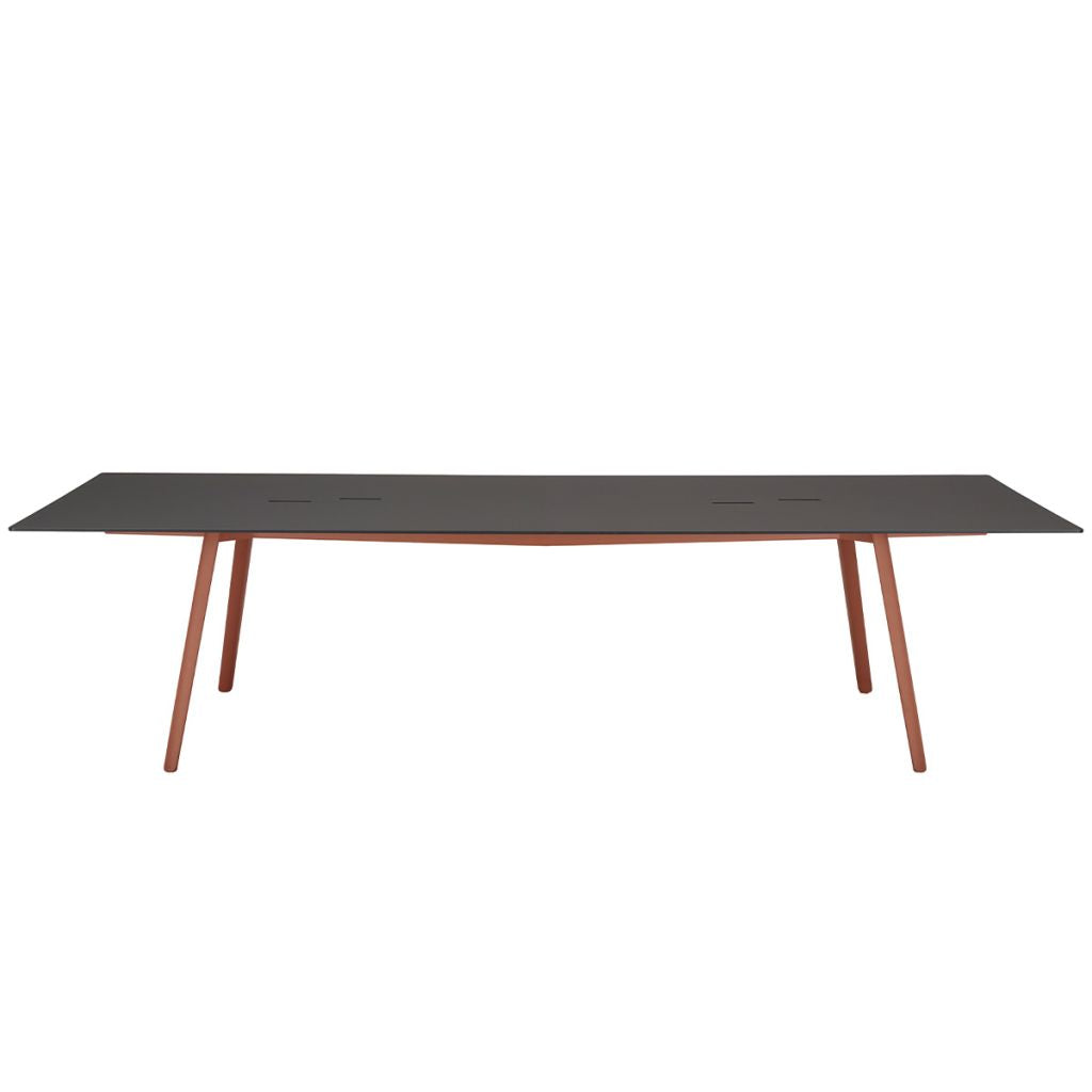 Front view of the S•CAB Squid OF Office Meeting Table featuring a black rectangular tabletop with integrated cable access and terracotta angled metal legs.