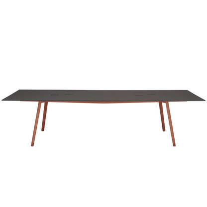 Front view of the S•CAB Squid OF Office Meeting Table featuring a black rectangular tabletop with integrated cable access and terracotta angled metal legs.