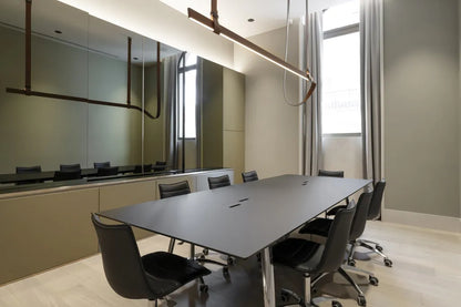 S•CAB Squid OF Office Meeting Table in a contemporary boardroom with integrated cable management and executive office chairs.