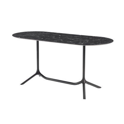 Front angled view of the S•CAB Tripé Double Dining Table Base with a black marble-effect oval tabletop and elegant double pedestal metal base.