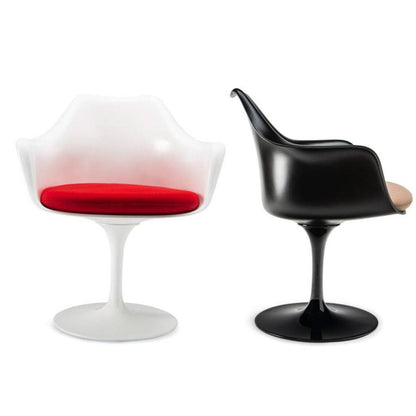 Front and side views of Tulip armchairs featuring a white shell with a red upholstered seat cushion and a black shell with a beige upholstered seat cushion, both with matching pedestal bases, inspired by Eero Saarinen's iconic mid-century modern Pedestal Collection.