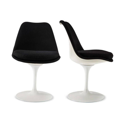 Front and side views of a Tulip pedestal dining chair with black upholstered seat and back, white moulded shell and white cast aluminium pedestal base, inspired by Eero Saarinen's iconic mid-century modern design.