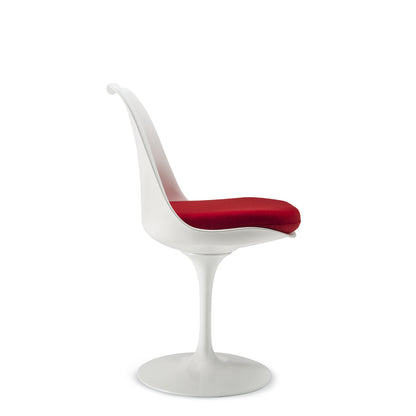 Side view of a Tulip pedestal dining chair with a white moulded shell, white cast aluminium base and red upholstered seat cushion, inspired by Eero Saarinen's iconic mid-century modern design