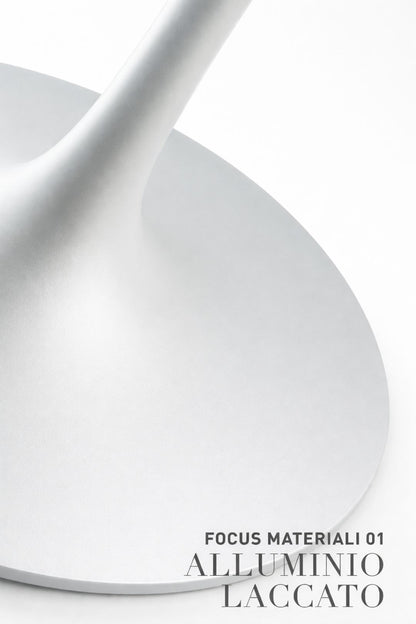Close-up of lacquered aluminium tulip table base in modern Italian design, showing smooth pedestal shape on white background